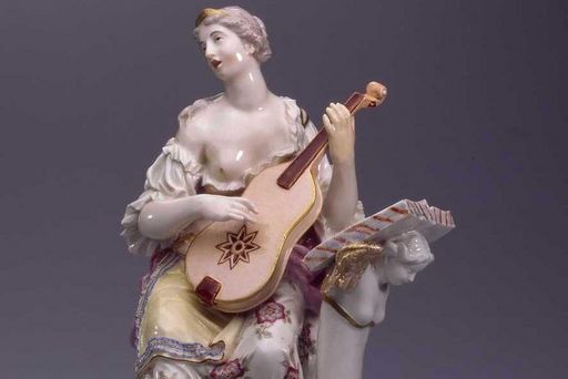 Porcelain woman playing the guitar